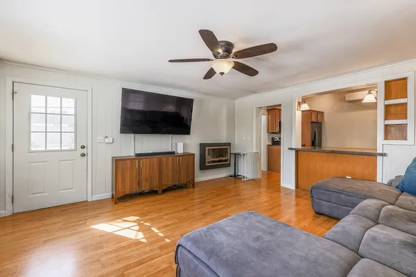 a living room with furniture and a flat screen tv