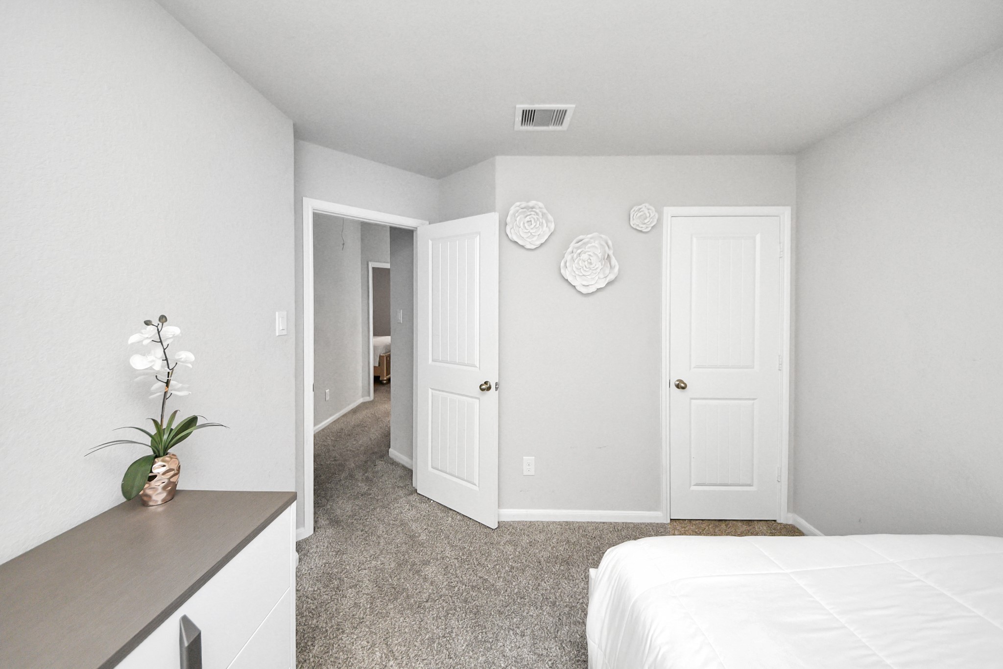 3514 Windham Way Katy, TX 77494 - Photo 13 of 42 a bedroom with a bed and a potted plant