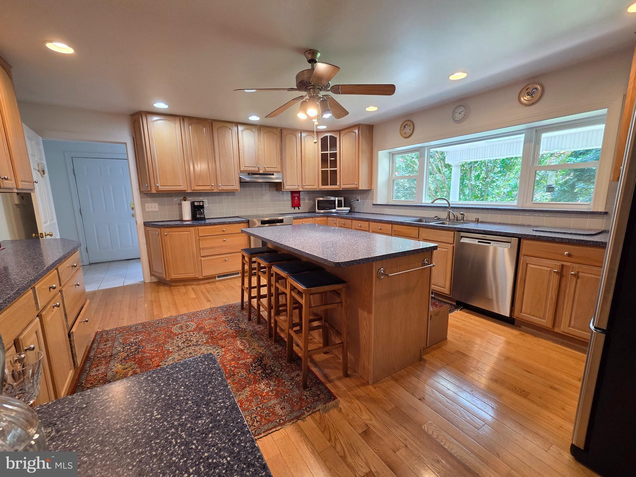178 Shed Road Douglassville, PA 19518 - Photo 11 of 58 a kitchen with stainless steel appliances granite countertop a sink a stove and a refrigerator