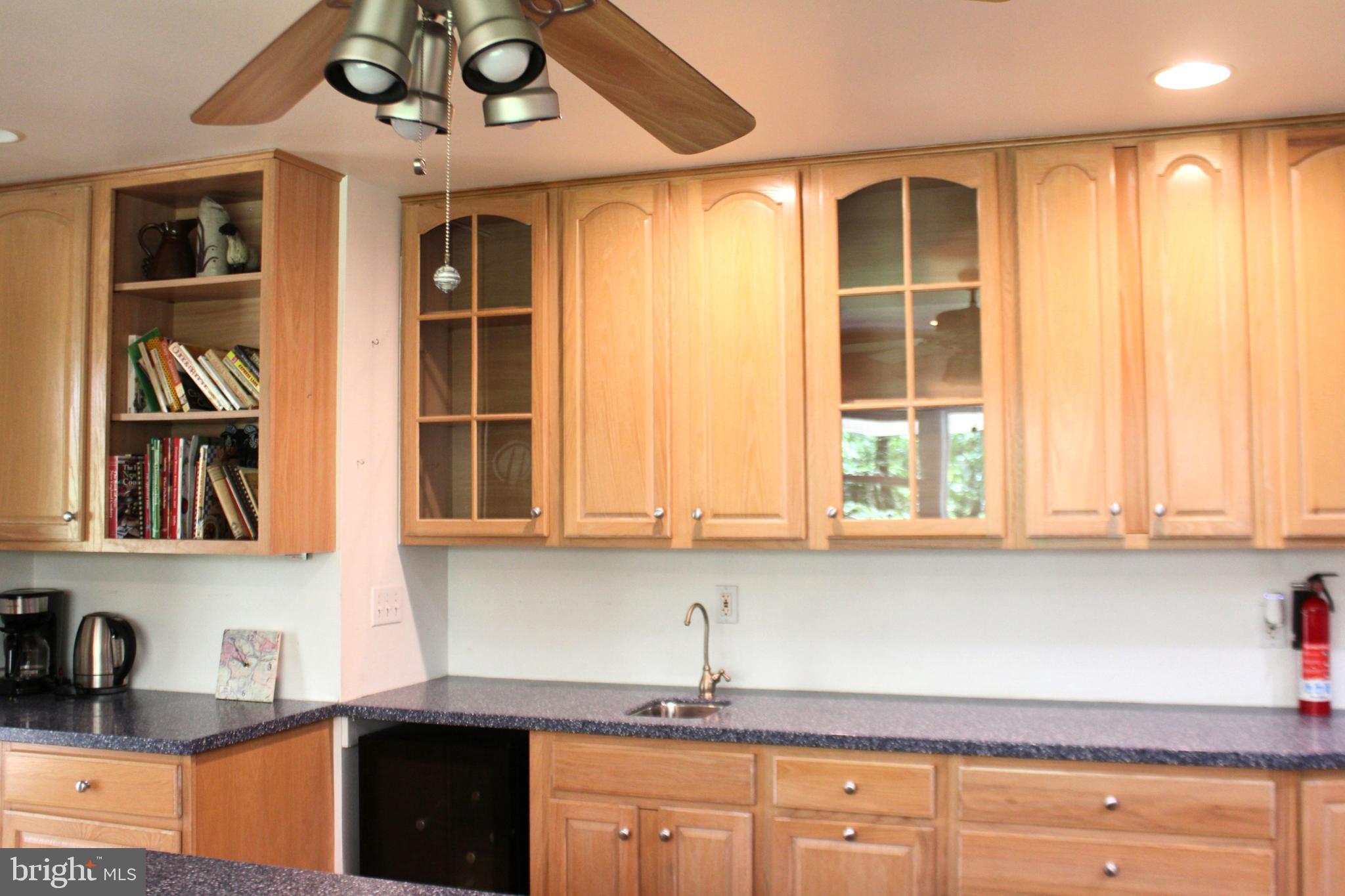 178 Shed Road Douglassville, PA 19518 - Photo 16 of 58 a kitchen with stainless steel appliances granite countertop white cabinets and window