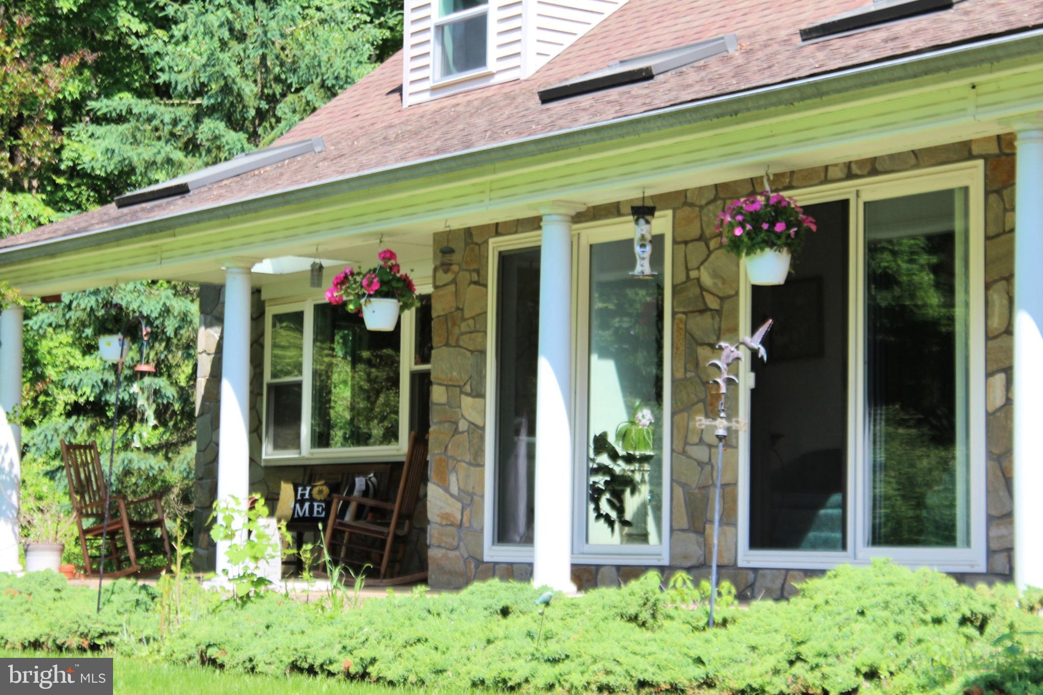 178 Shed Road Douglassville, PA 19518 - Photo 4 of 58 a front view of a building with garden