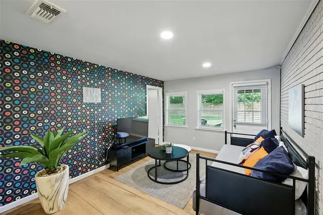 a living room with furniture and flowers