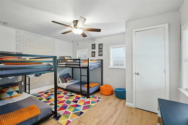 a bedroom with furniture and a baby crib