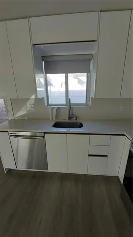 a kitchen with a sink and a cabinets