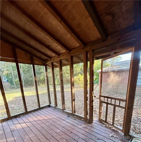 a view of hallway with wooden stairs