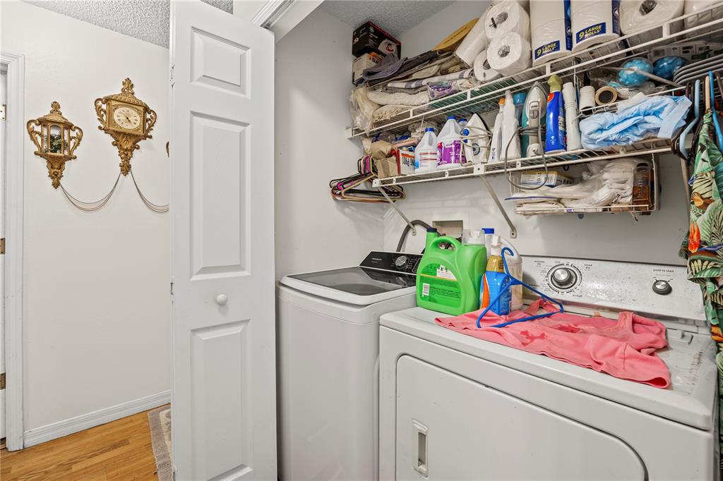 8453 Apple Orchard Road Spring Hill, FL 34608 - Photo 32 of 66 a utility room with dryer and washer