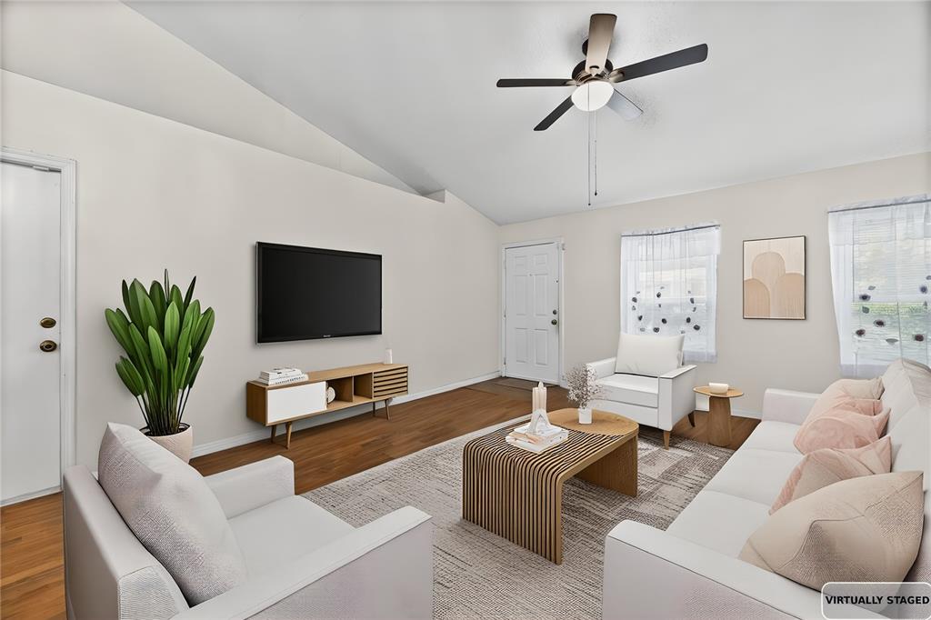 8453 Apple Orchard Road Spring Hill, FL 34608 - Photo 40 of 66 a living room with furniture and a flat screen tv