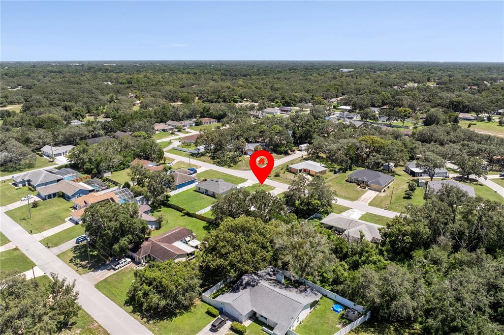 8453 Apple Orchard Road Spring Hill, FL 34608 - Photo 4 of 66 an aerial view of residential houses with outdoor space and trees