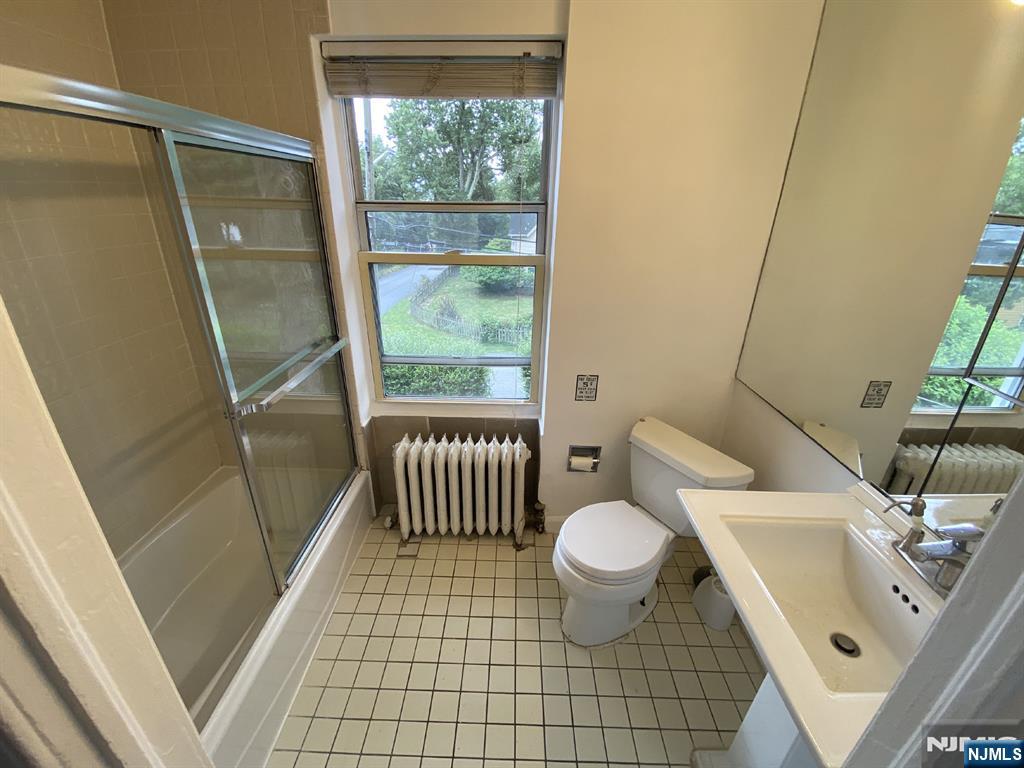 59 Forest Street Alpine, NJ 07620 - Photo 11 of 16 a bathroom with a sink toilet and shower