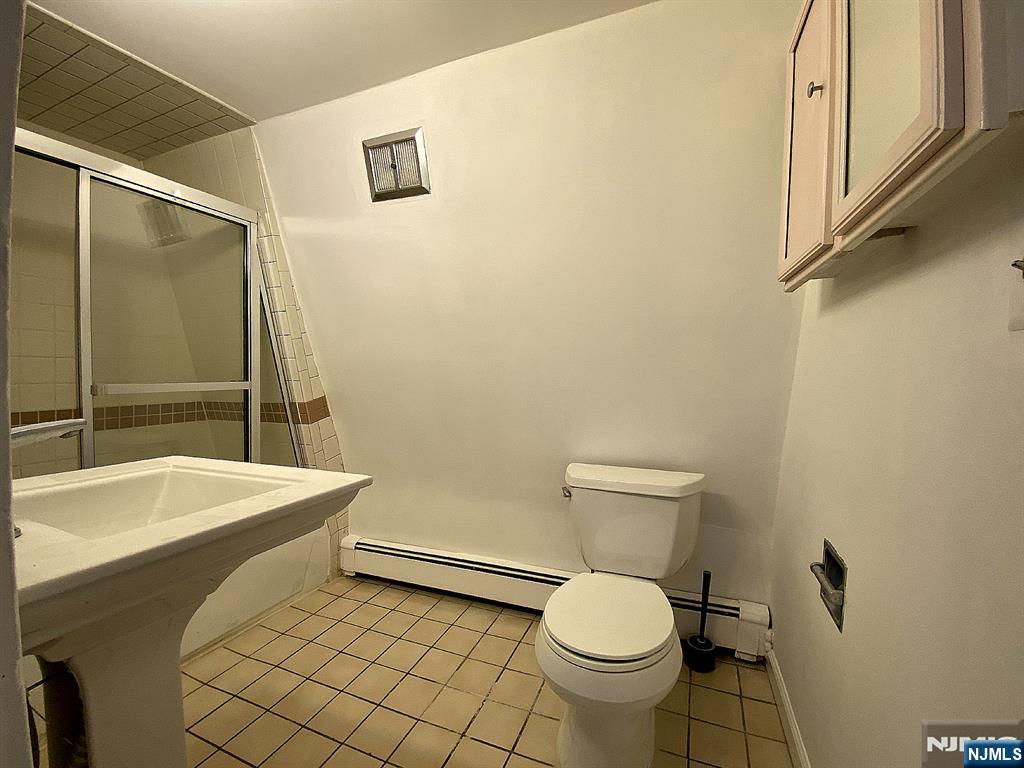 59 Forest Street Alpine, NJ 07620 - Photo 15 of 16 a bathroom with a sink and a toilet