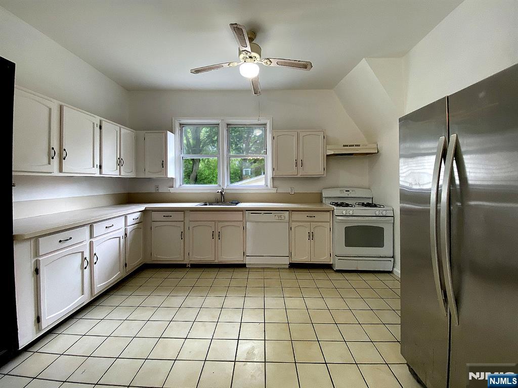 59 Forest Street Alpine, NJ 07620 - Photo 5 of 16 a kitchen with a sink cabinets and window