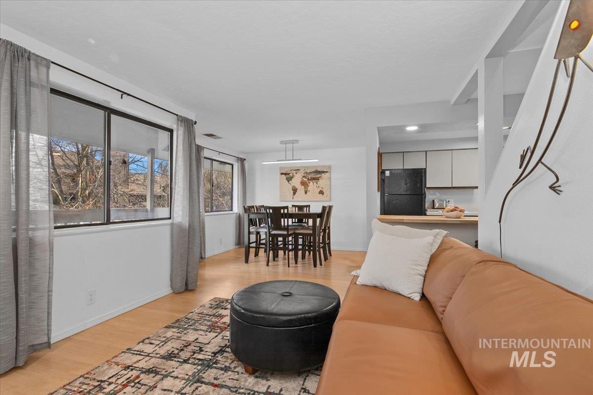 3651 South Gekeler Lane, Unit 96 Boise, ID 83706 - Photo 4 of 38 Living area featuring light wood-type flooring and baseboards