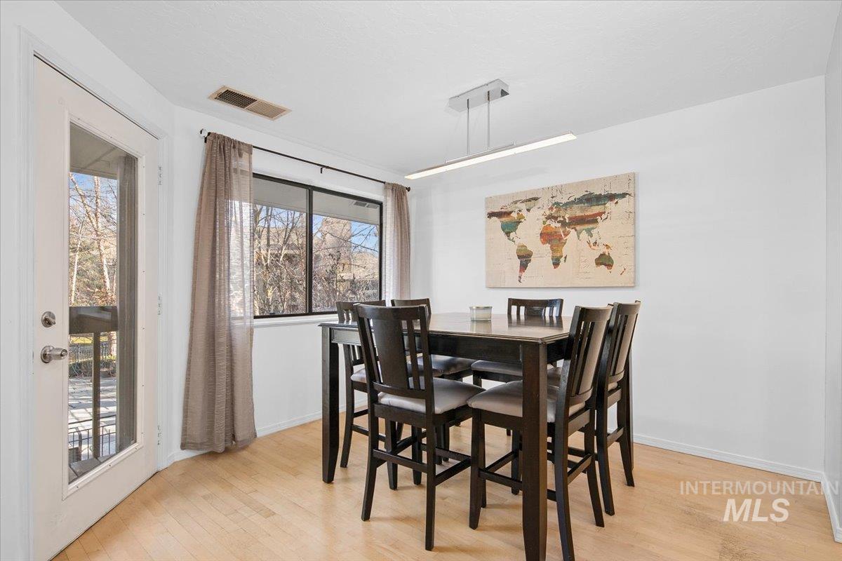 3651 South Gekeler Lane, Unit 96 Boise, ID 83706 - Photo 5 of 38 Dining space with light wood finished floors
