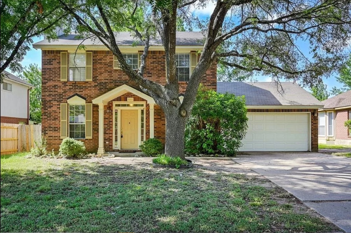 2008 Heather Drive Cedar Park, TX 78613 - Photo 1 of 8 a front view of a house with garden