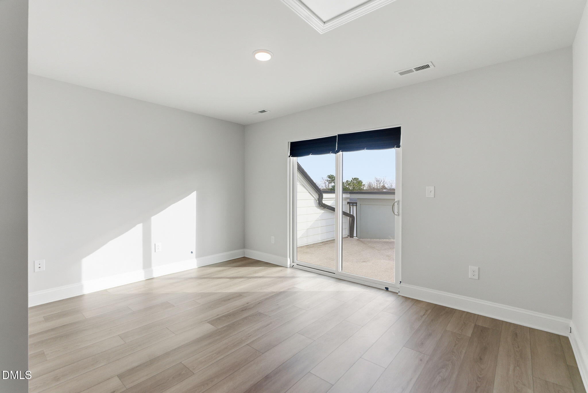 501 Hedrick Ridge Road Cary, NC 27519 - Photo 35 of 47 an empty room with wooden floor and windows