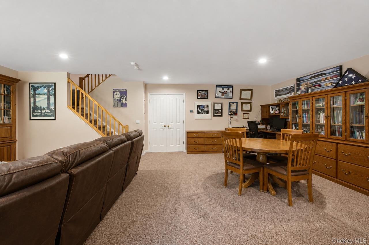 64 Roma Orchard Road Peekskill, NY 10566 - Photo 32 of 40 Spacious room with plush carpeting, recessed lighting, and a wood-finish staircase with open risers