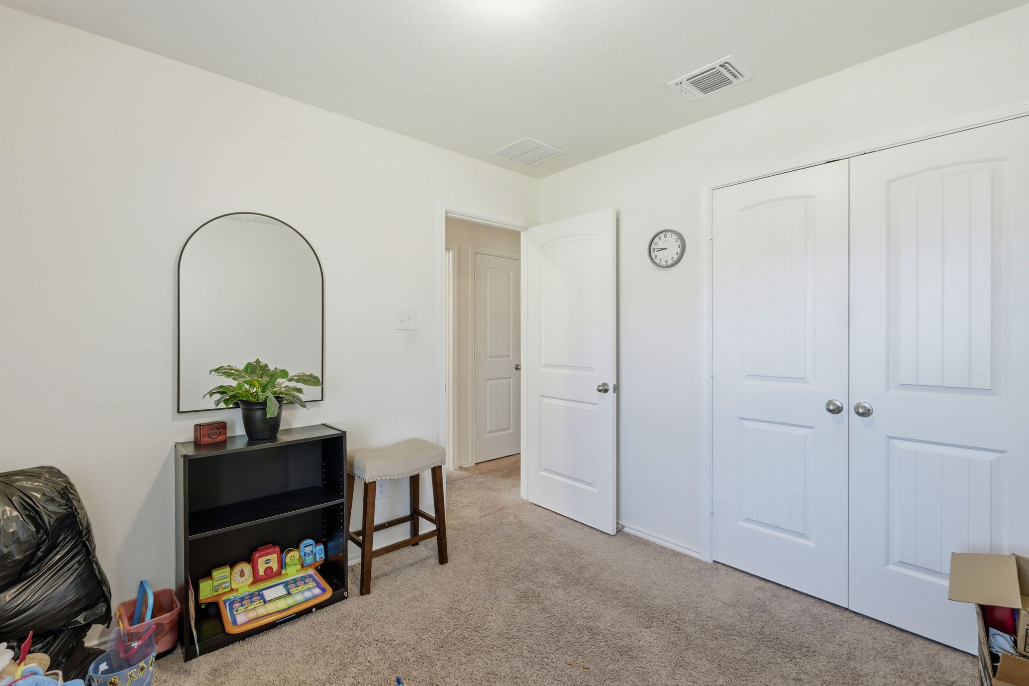 220 Lucky Texan Road Jarrell, TX 76537 - Photo 10 of 19 A comfortable bedroom with soft carpeting and ample closet space offers versatile living options.