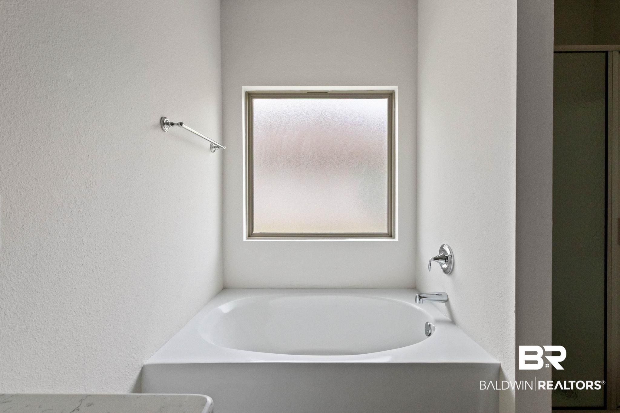 1710 Grouse Street Foley, AL 36535 - Photo 42 of 76 Recessed bathtub with a frosted window, chrome fixtures, and a white finish
