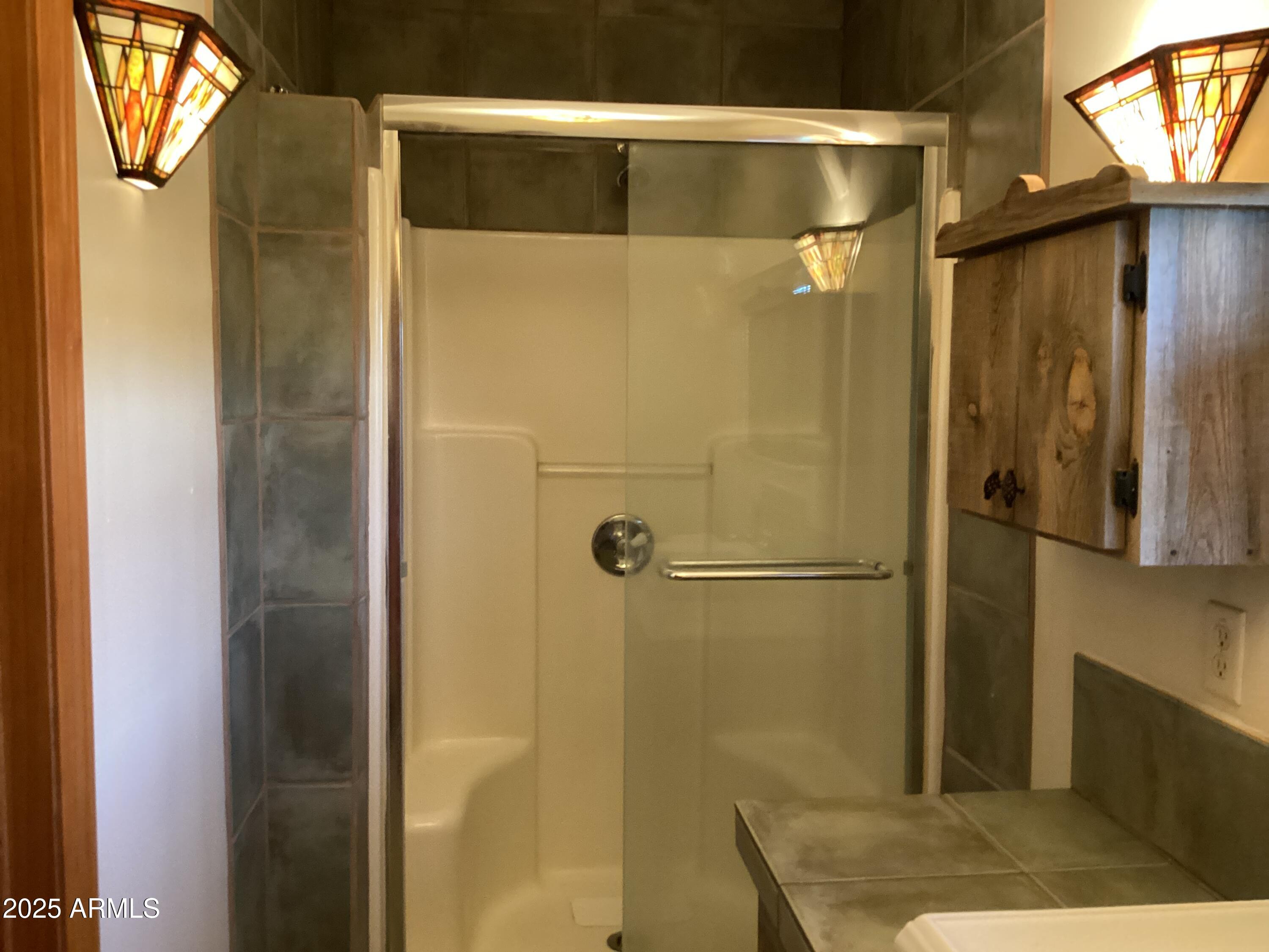 10023 North Bell Road Elfrida, AZ 85610 - Photo 14 of 51 a bathroom with a shower