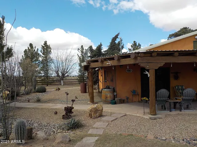a view of a chairs and tables in patio