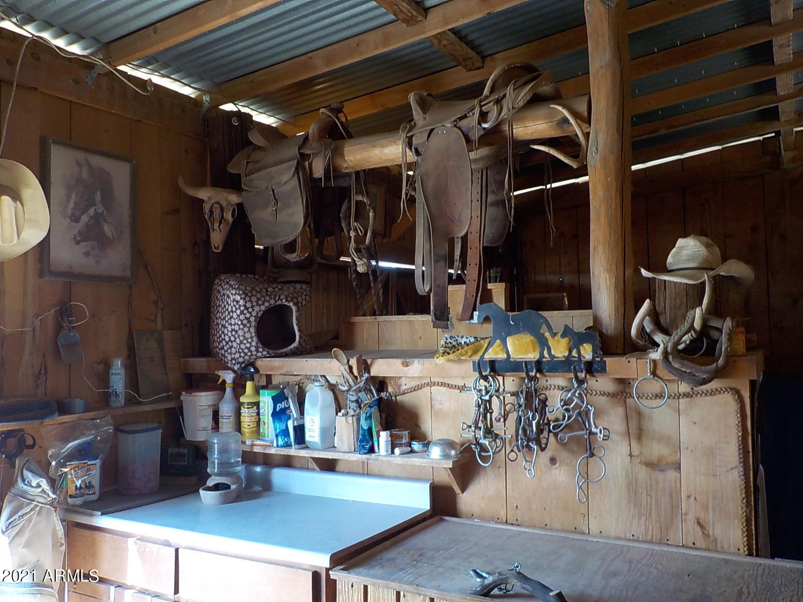 10023 North Bell Road Elfrida, AZ 85610 - Photo 28 of 51 a room with lots of furniture and clutter