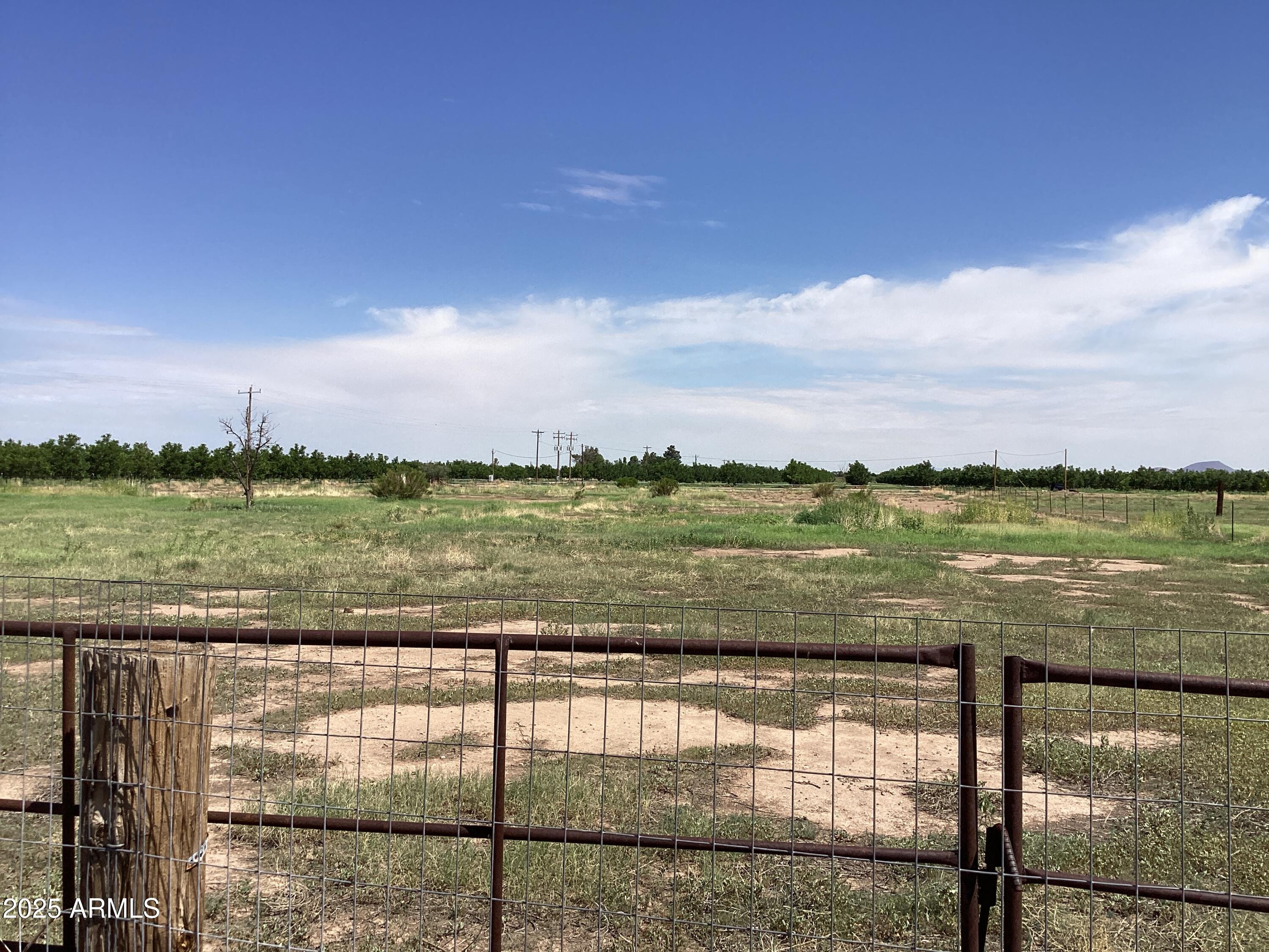 10023 North Bell Road Elfrida, AZ 85610 - Photo 32 of 51 a view of a lake from a yard