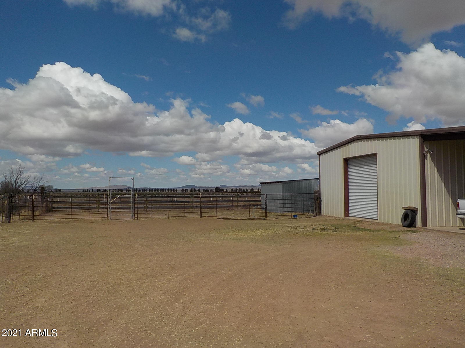 10023 North Bell Road Elfrida, AZ 85610 - Photo 39 of 51 a view of a house with a yard