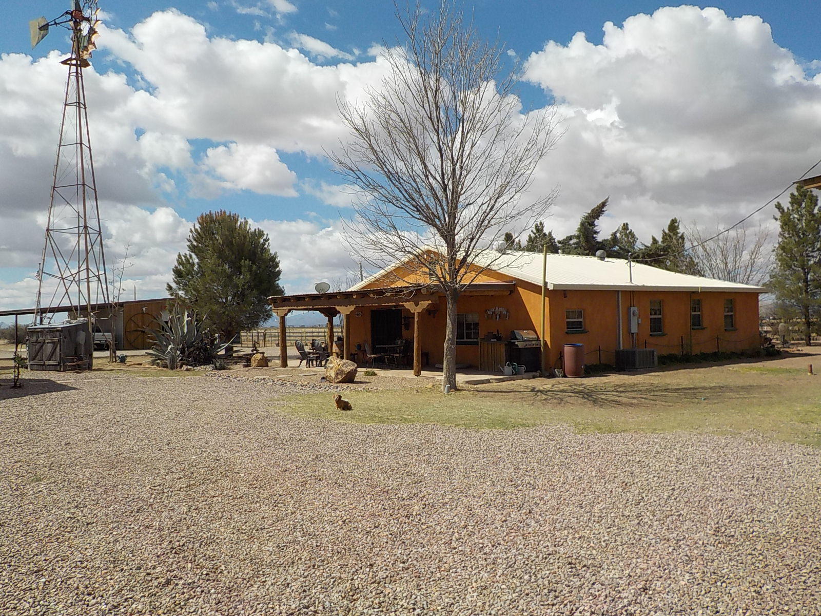 10023 North Bell Road Elfrida, AZ 85610 - Photo 3 of 51 a front view of a house with a yard and garage