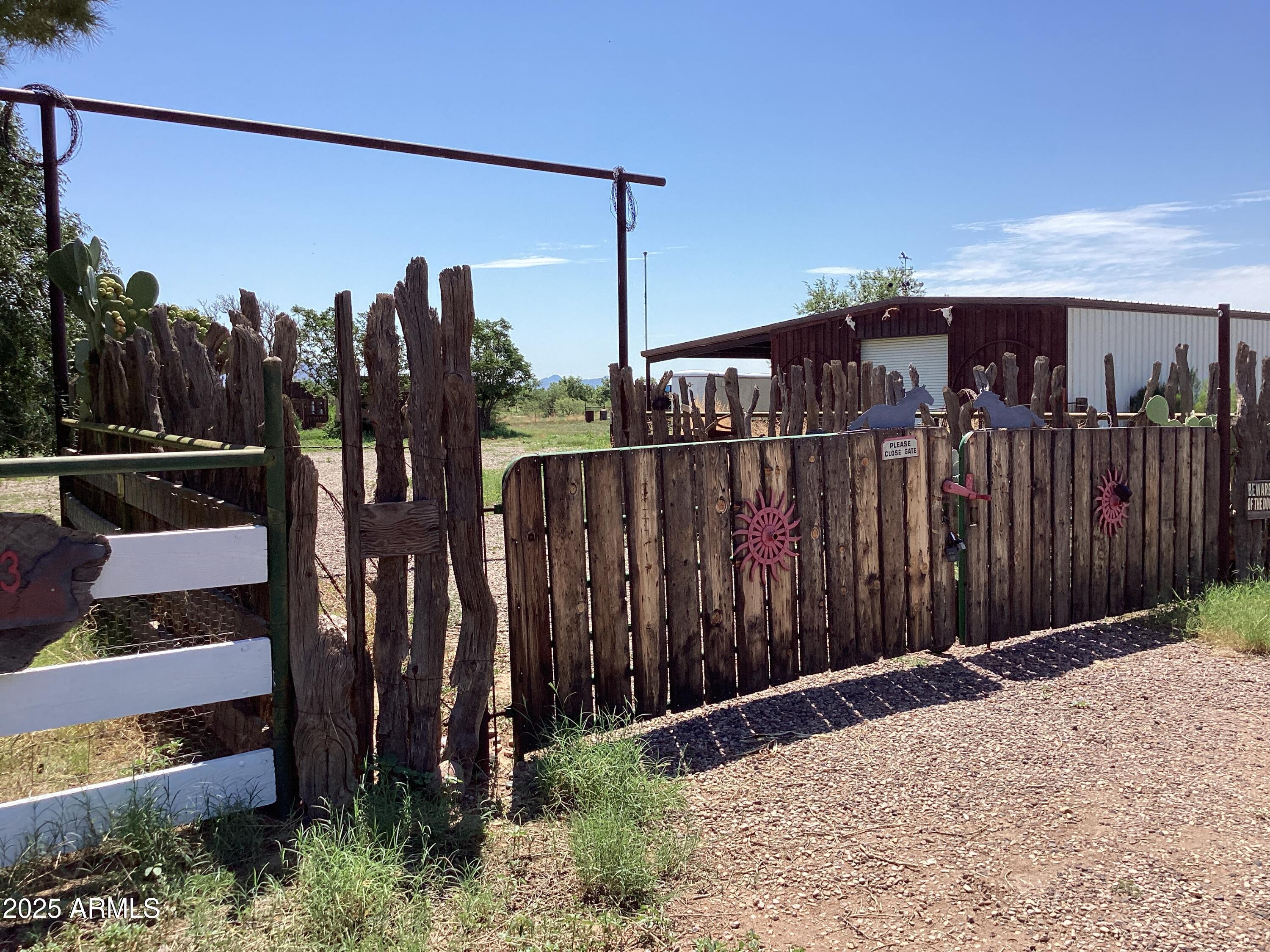 10023 North Bell Road Elfrida, AZ 85610 - Photo 42 of 51 a view of a house with a backyard
