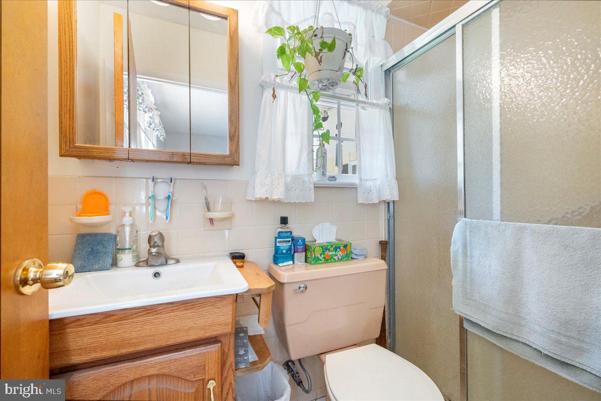 1714 Moyers Road Hatfield, PA 19440 - Photo 15 of 31 a bathroom with a sink toilet and shower