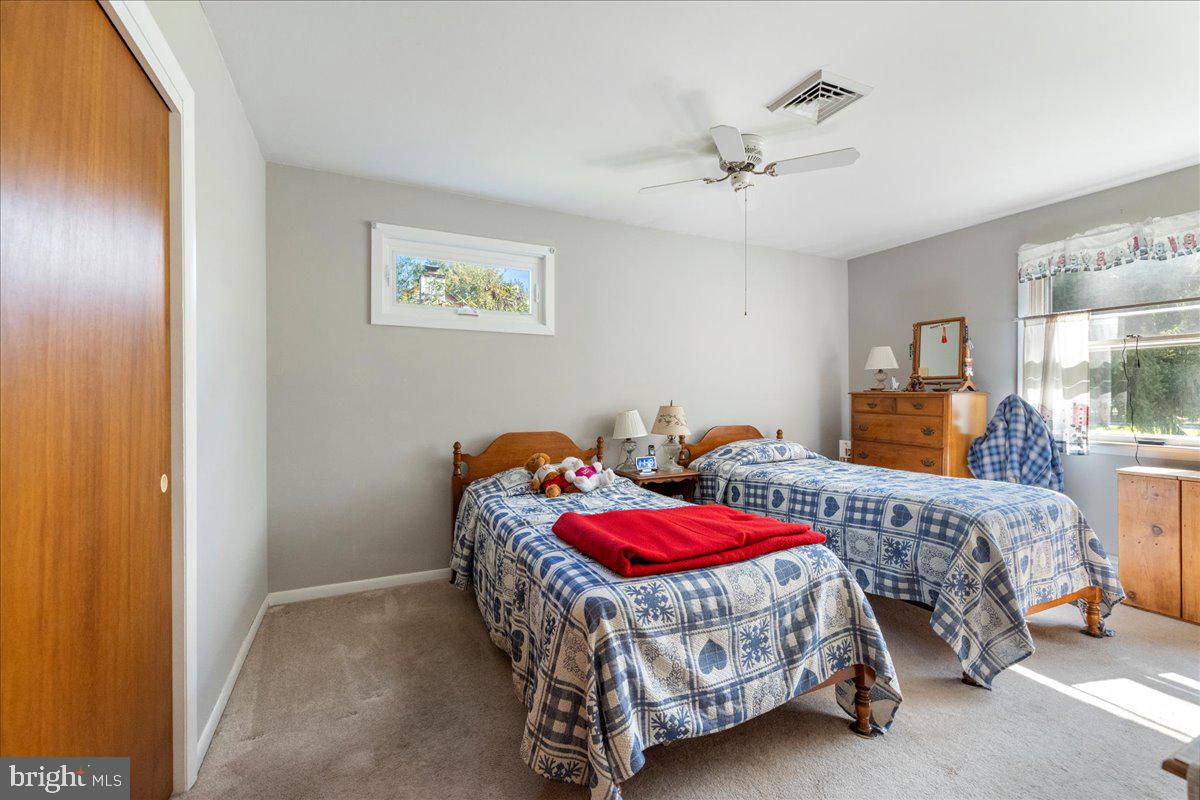 1714 Moyers Road Hatfield, PA 19440 - Photo 16 of 31 a bedroom with two beds and a chandelier