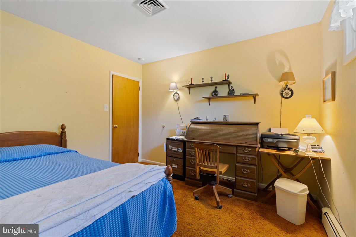 1714 Moyers Road Hatfield, PA 19440 - Photo 20 of 31 a bedroom with a bed and furniture