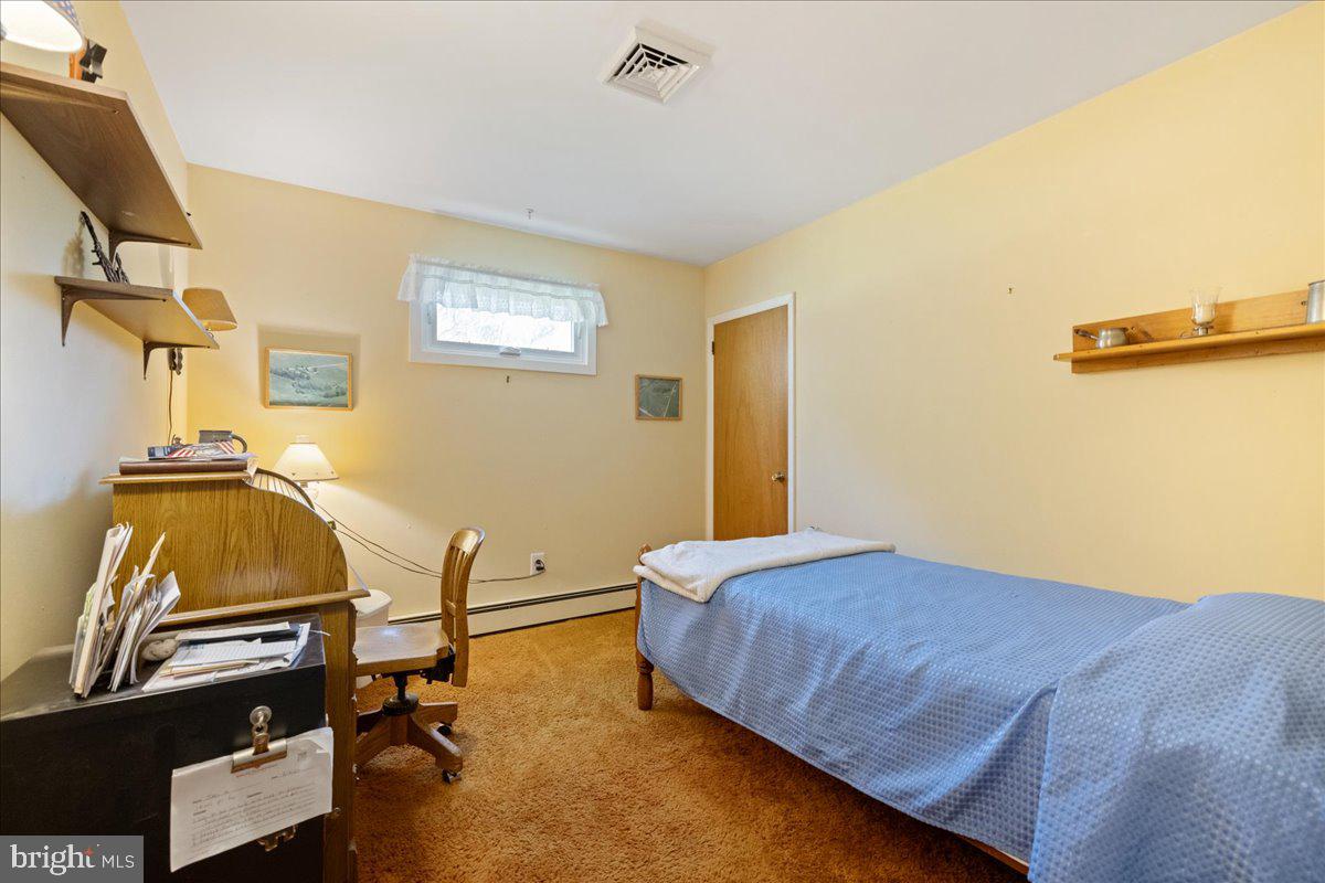 1714 Moyers Road Hatfield, PA 19440 - Photo 21 of 31 a bedroom with a bed and a desk