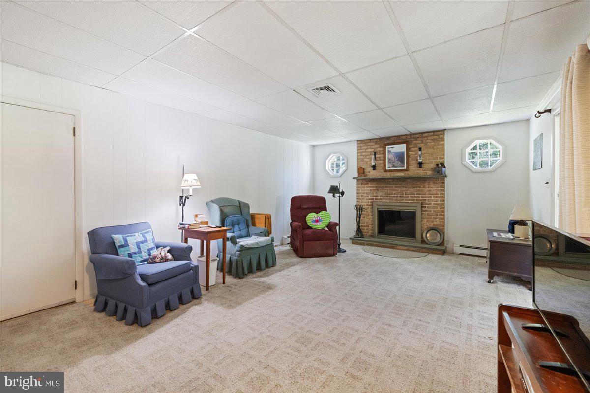 1714 Moyers Road Hatfield, PA 19440 - Photo 10 of 31 a living room with furniture and a fireplace