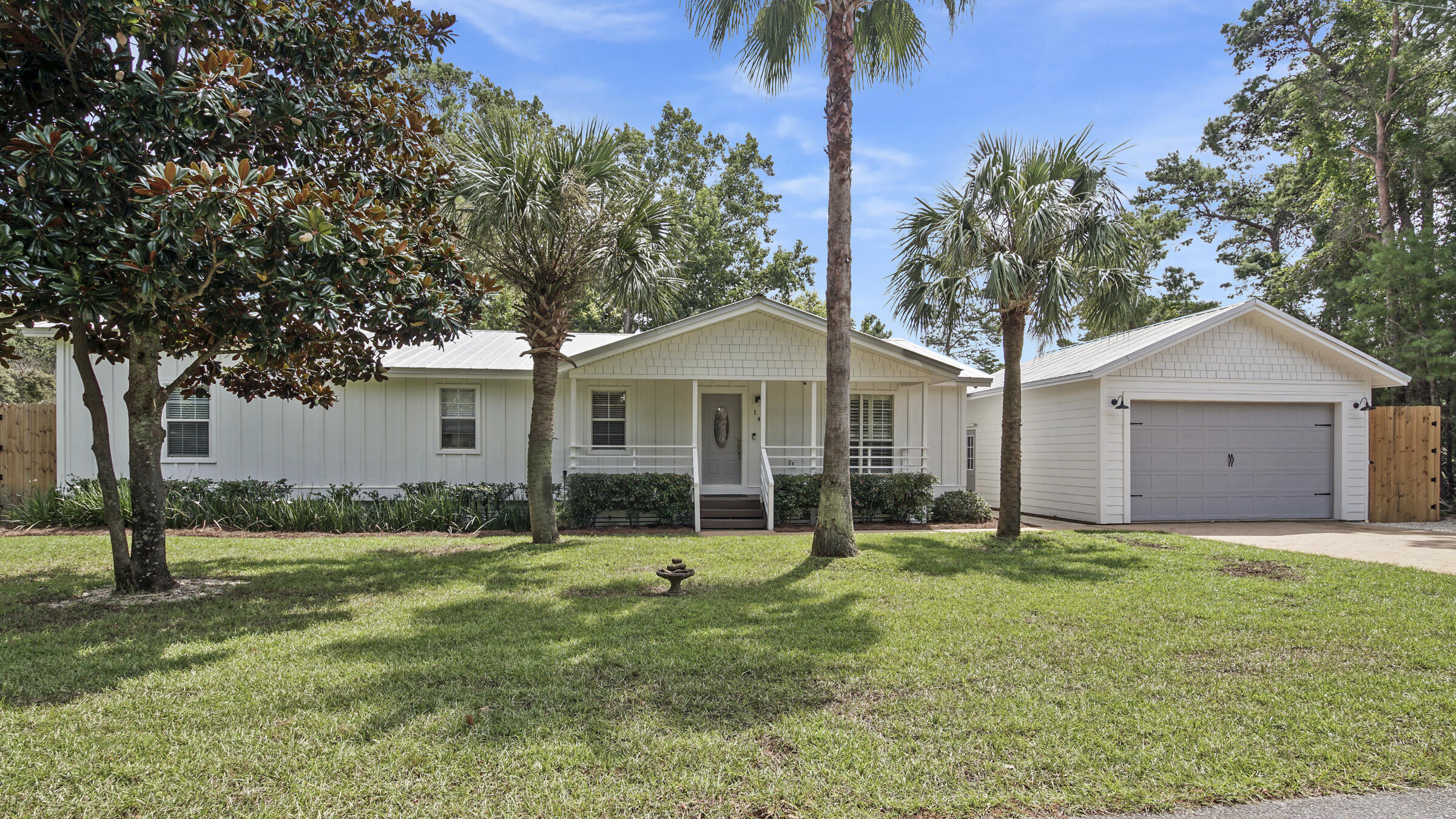 149 Acacia Street Santa Rosa Beach, FL 32459 - Photo 1 of 45 a front view of house with yard and green space