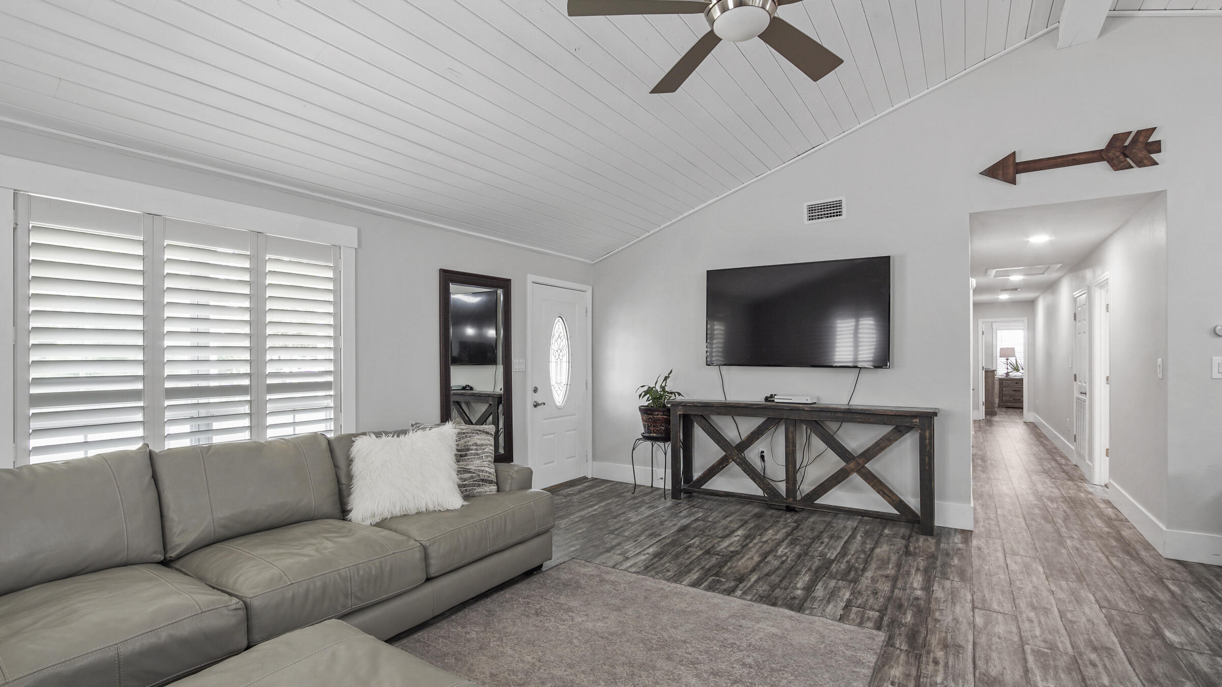 149 Acacia Street Santa Rosa Beach, FL 32459 - Photo 10 of 45 a living room with furniture and a flat screen tv
