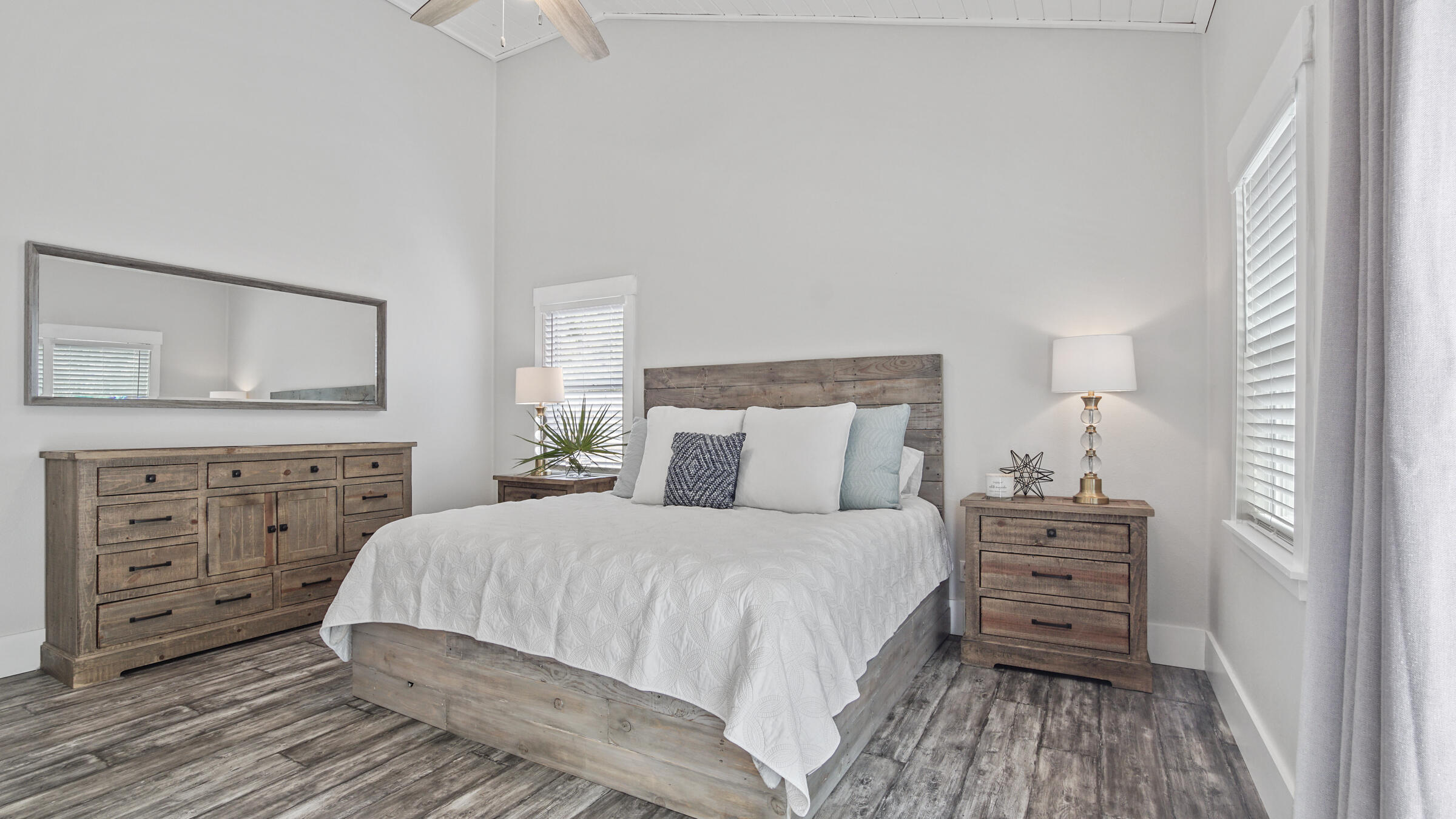 149 Acacia Street Santa Rosa Beach, FL 32459 - Photo 12 of 45 a bedroom with a bed and a dresser