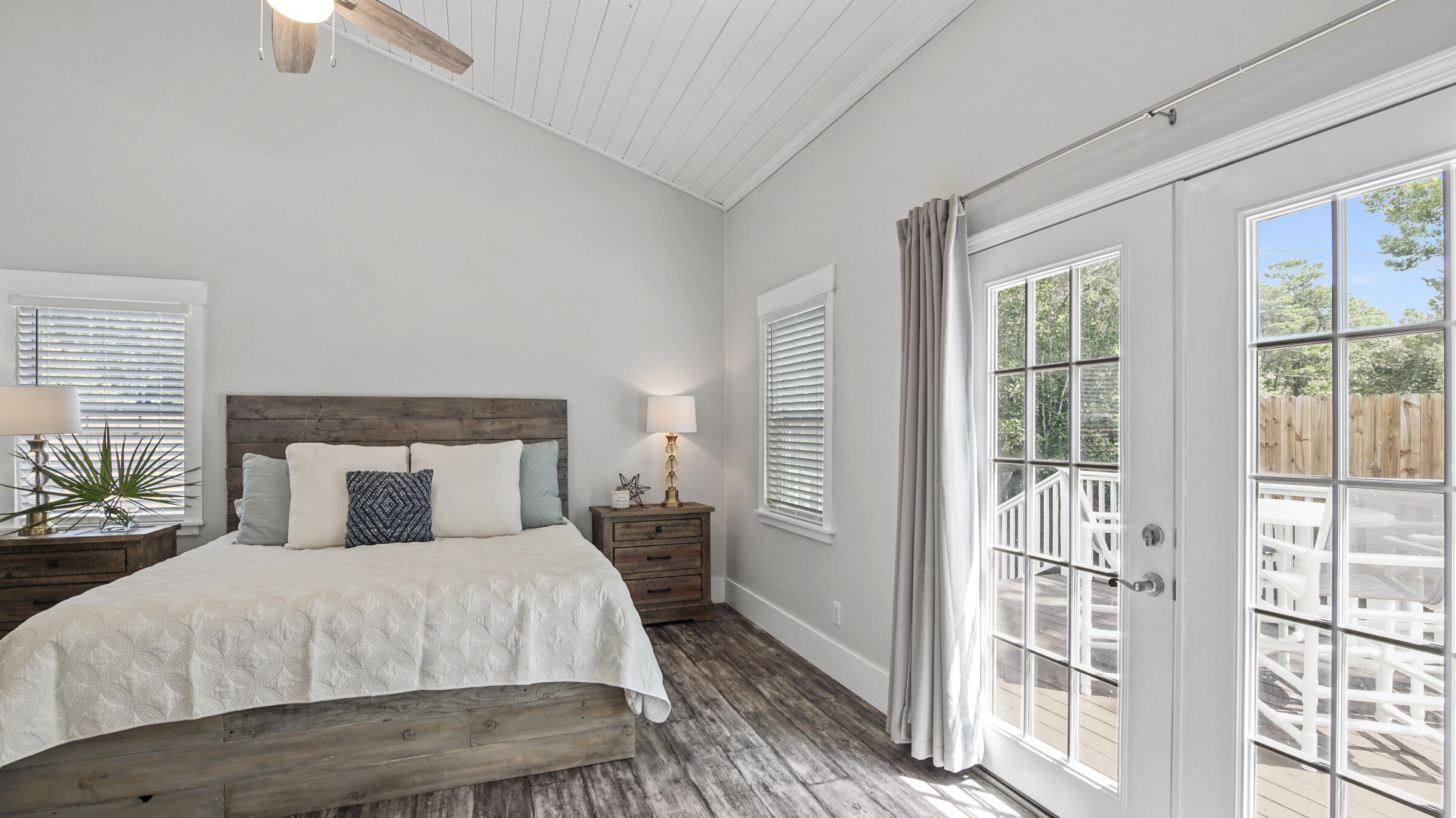 149 Acacia Street Santa Rosa Beach, FL 32459 - Photo 13 of 45 a bedroom with a large bed and a large window