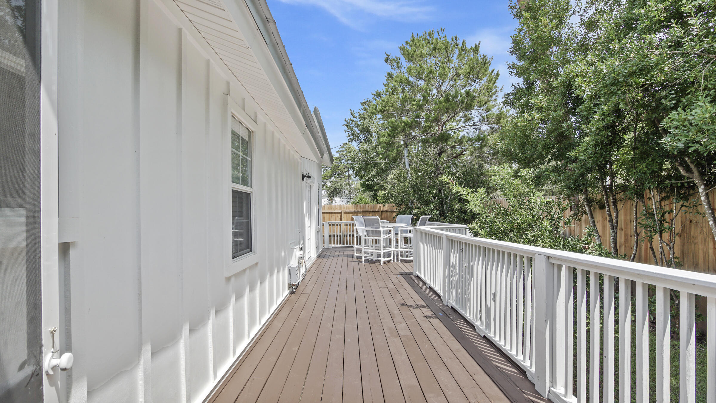 149 Acacia Street Santa Rosa Beach, FL 32459 - Photo 31 of 45 a view of balcony with wooden floor and fence