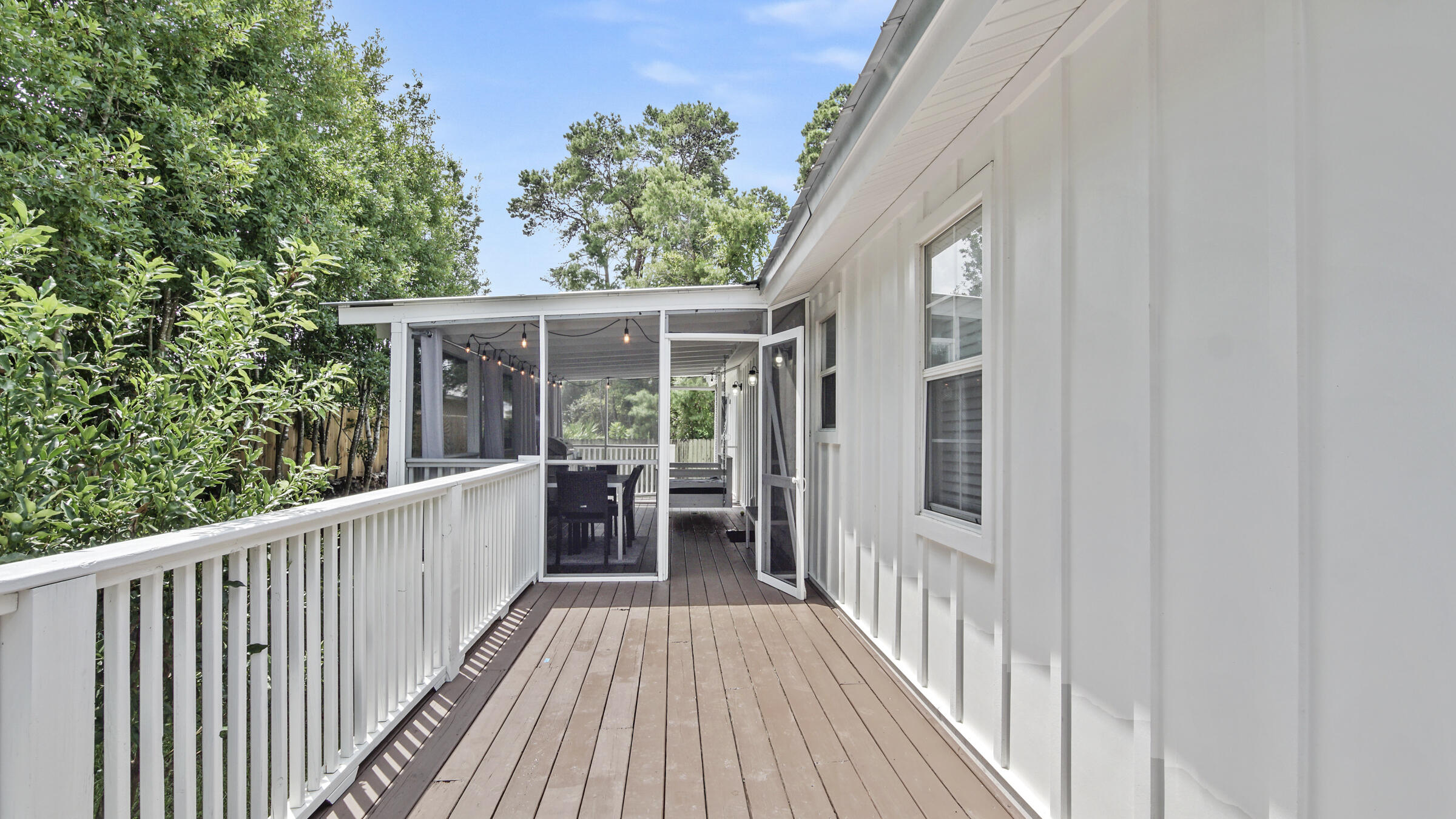 149 Acacia Street Santa Rosa Beach, FL 32459 - Photo 33 of 45 a view of a house with backyard and deck
