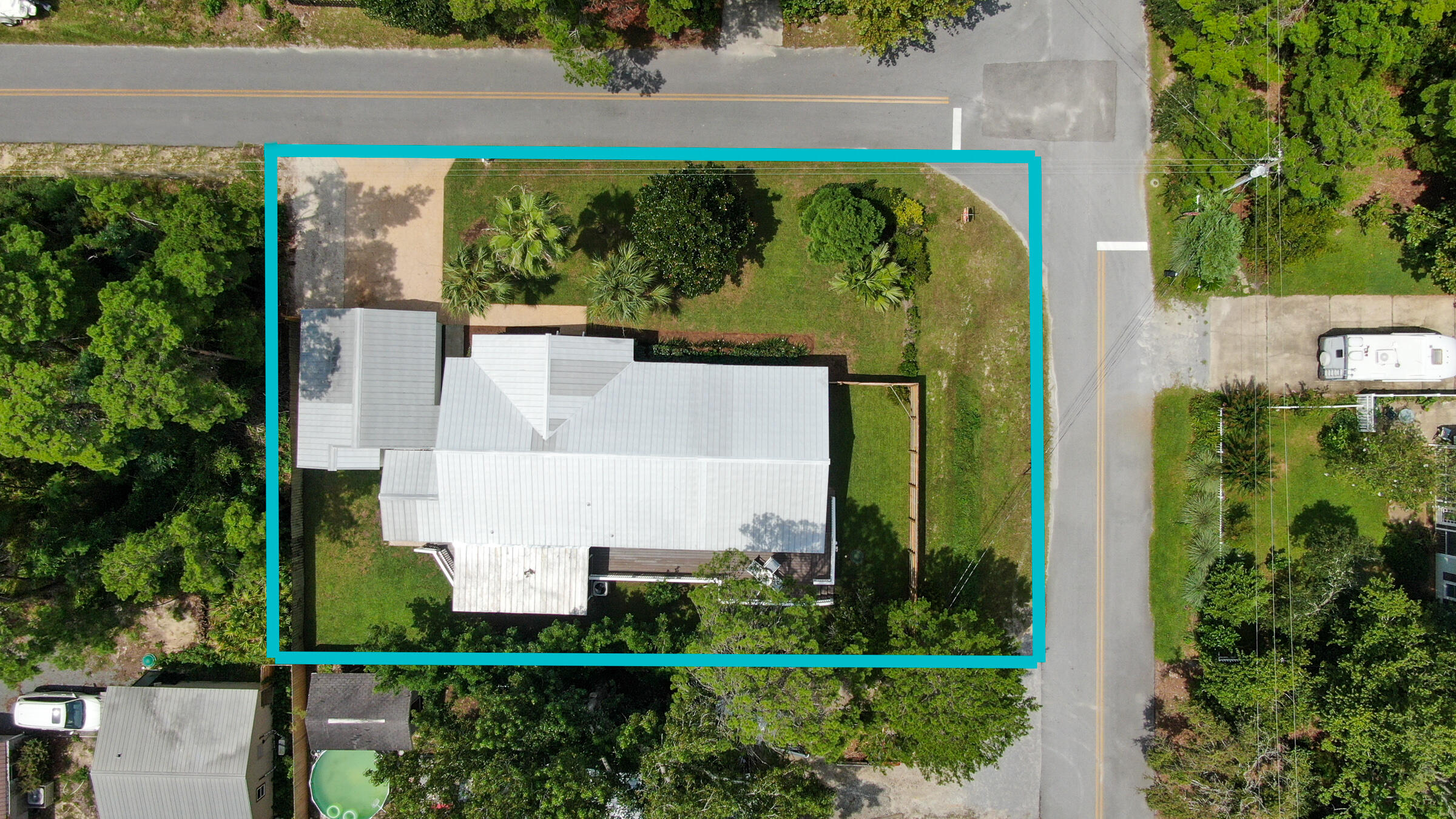 149 Acacia Street Santa Rosa Beach, FL 32459 - Photo 40 of 45 an aerial view of a house with a yard and plants