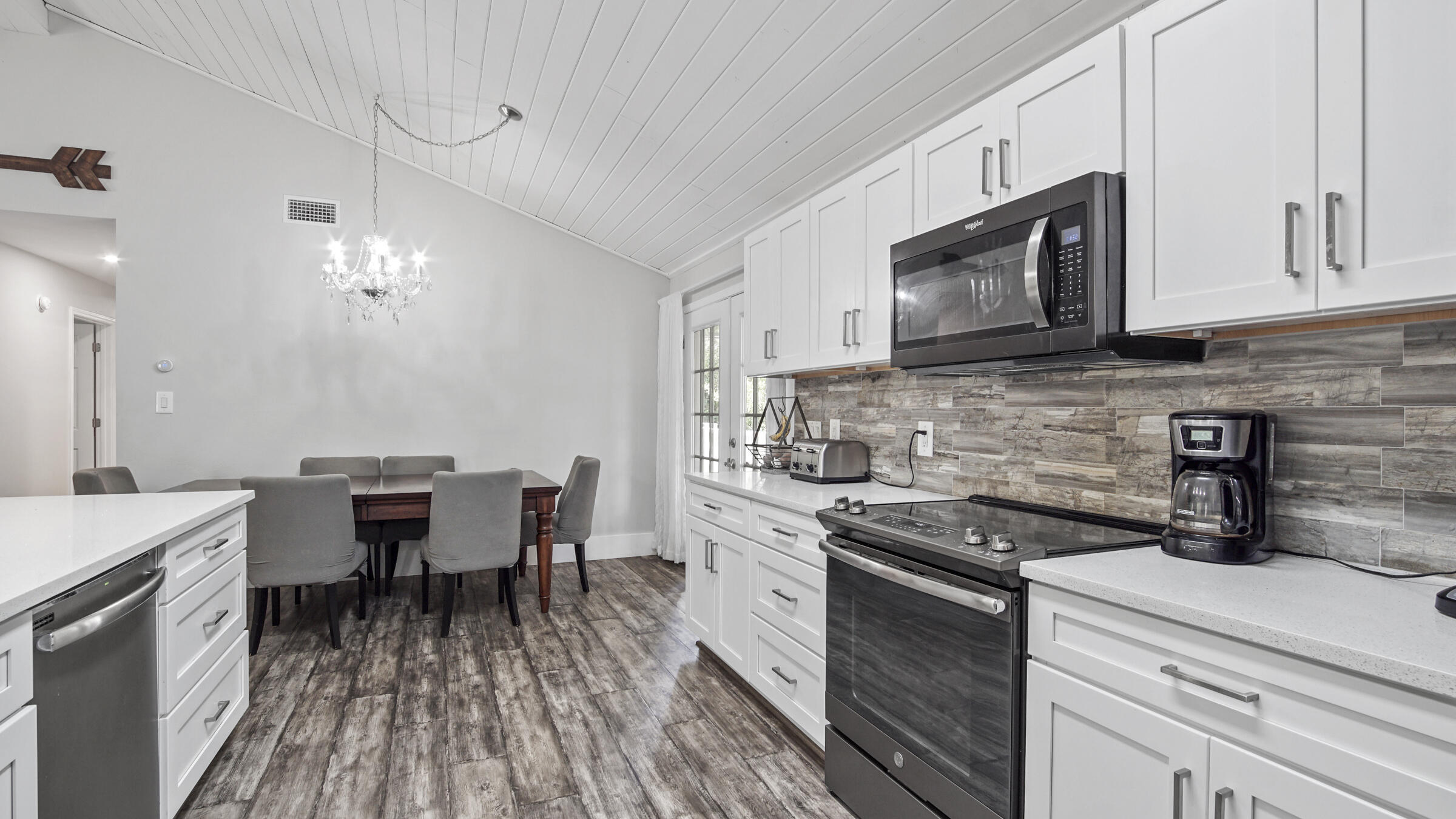 149 Acacia Street Santa Rosa Beach, FL 32459 - Photo 6 of 45 a kitchen with a sink stove and microwave