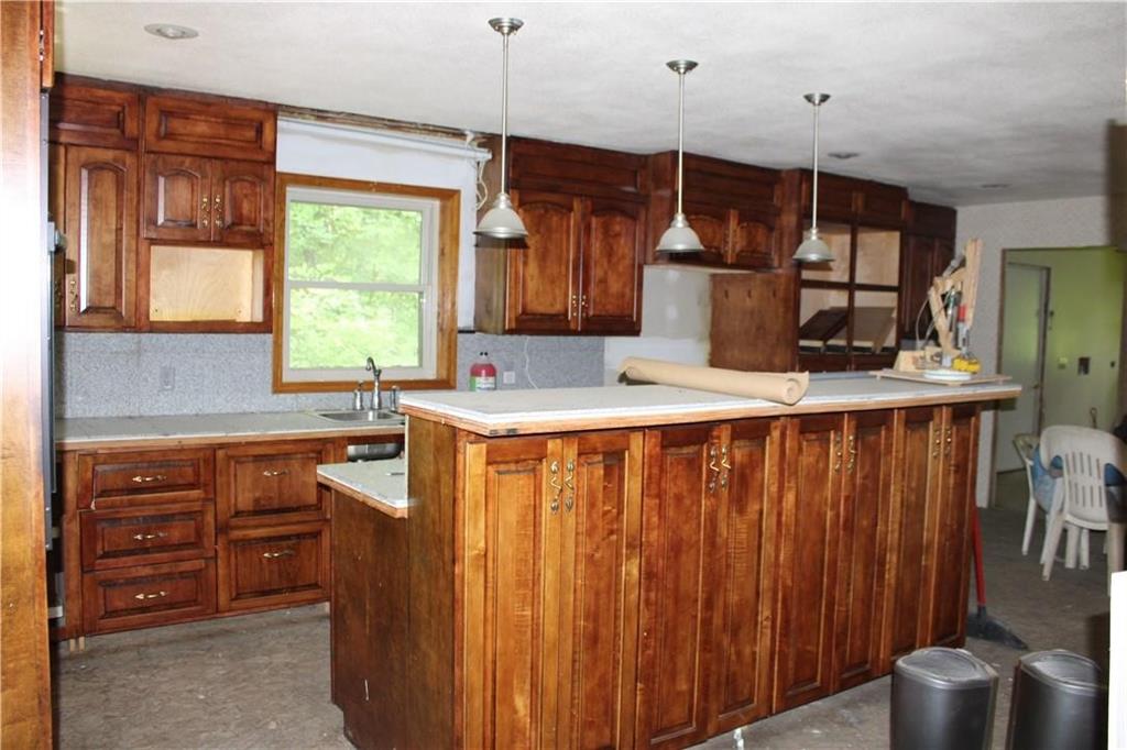 200 McHaddon Road Kittanning, PA 16201 - Photo 13 of 16 a kitchen with wooden cabinets and a sink