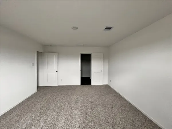 a kitchen with kitchen island white cabinets and stainless steel appliances