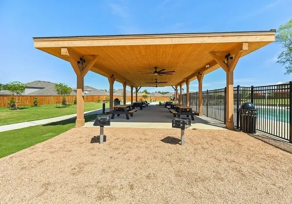 a view of a swimming pool with a patio