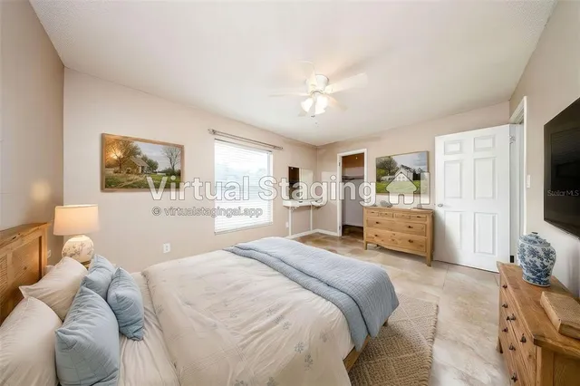 a bedroom with a bed window and furniture