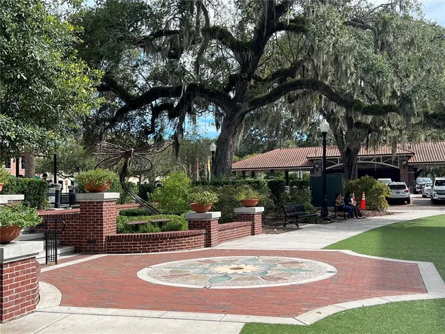 a view of a backyard with sitting area