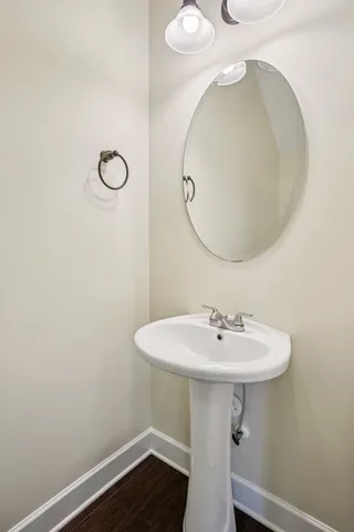 a bathroom with a sink a mirror and a toilet