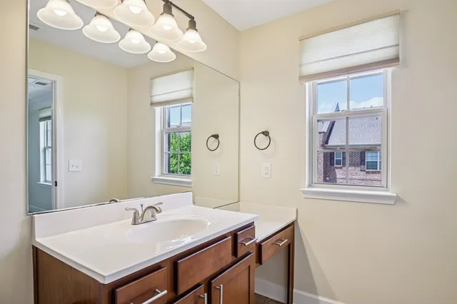 a view of a dining room with a table and chairs