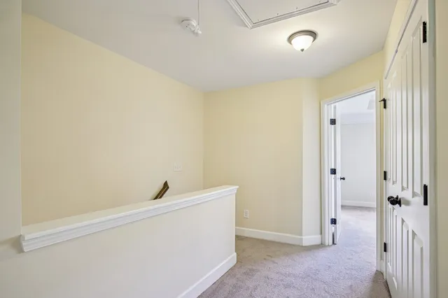 a view of a room with wooden floor and sink